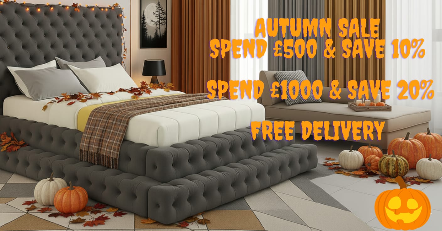 Gray tufted bed with decorative pumpkins and leaves in a bedroom setting, featuring an autumn sale promotion.